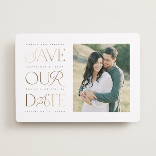 This is a opal foil stamped save the date cards with foil pressed by Leah Bisch called stack printing on recycled smooth signature in standard