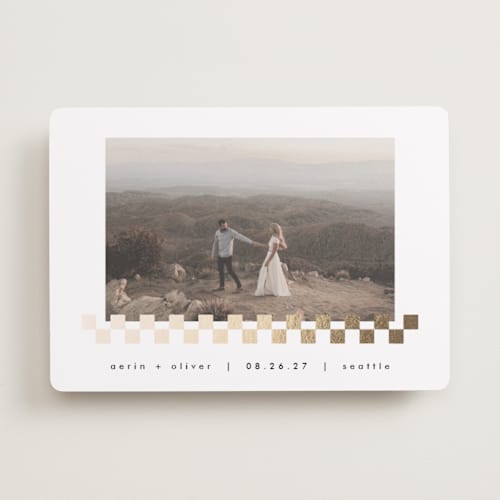 This is a snow foil stamped save the date cards with foil pressed by AK Graphics called checkered printing on recycled smooth signature in standard