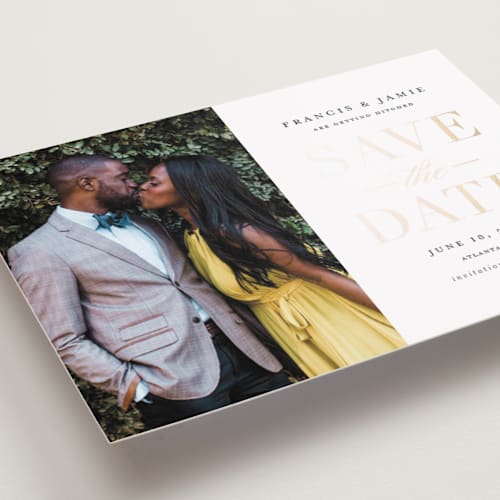This is a gold giltz foil stamped save the date cards with foil pressed by Stacey Meacham called simply striking printing on recycled smooth signature in grand