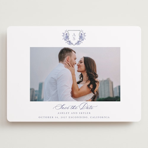 This is a dusty blue save the date with standard by Cass Loh called watercolor flowers crest printing on recycled smooth signature in grand