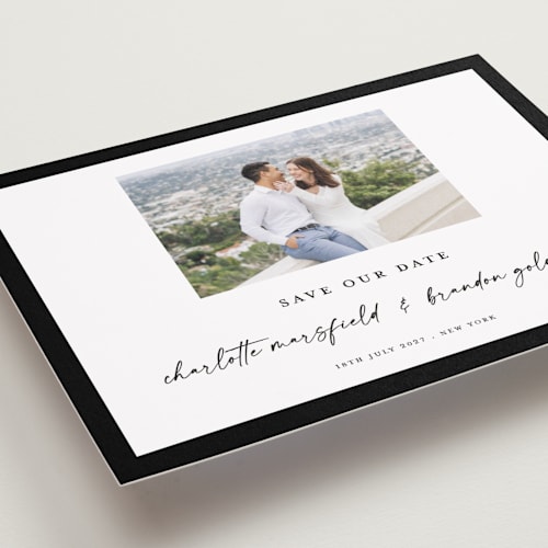 This is a onyx petite save the dates with standard by Devika Keskar called main event printing on recycled smooth signature in petite