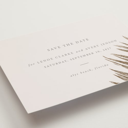 This is a sand petite save the dates with foil pressed by Melinda Denison called gilded palm printing on signature in petite
