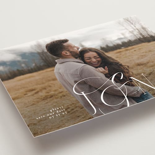 This is a ivory save the date postcards with standard by Phrosné Barwood called beautiful monogram printing on signature in postcard
