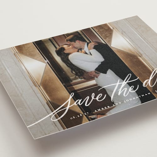 This is a chamomile save the date postcards with standard by Wildfield Paper Co called daisy printing on signature in postcard
