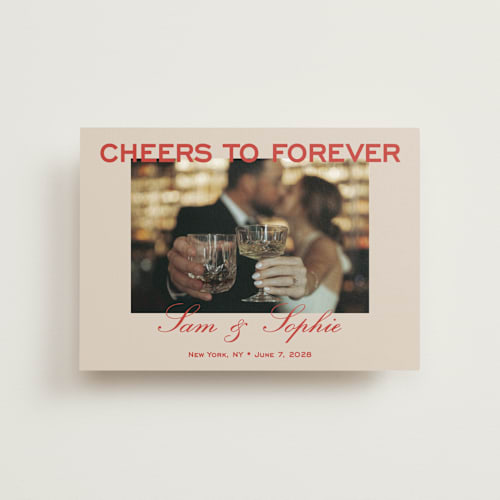This is a tomato petite save the dates with standard by Sydney Kay called bold cheers printing on recycled smooth signature in petite