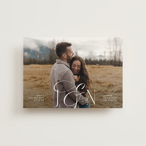 This is a ivory save the date postcards with standard by Phrosné Barwood called beautiful monogram printing on signature in postcard