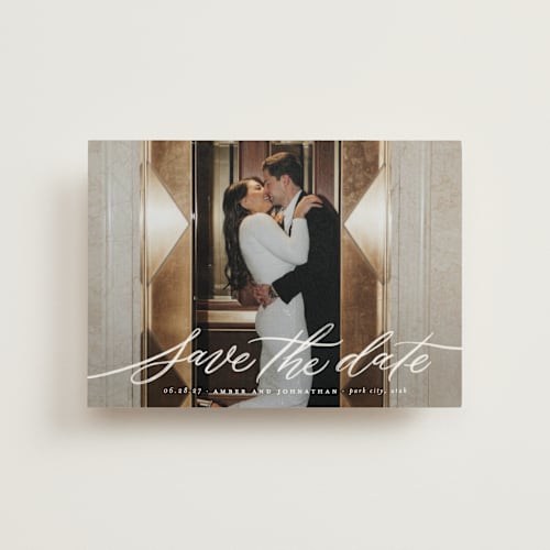 This is a chamomile save the date postcards with standard by Wildfield Paper Co called daisy printing on signature in postcard