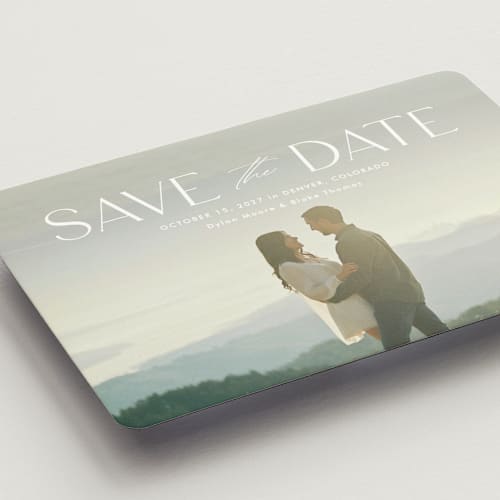 This is a cloud save the date magnets with standard by Kate Ahn called monterosso printing on magnet paper in magnet