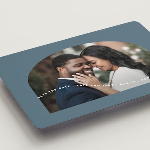 This is a dusty blue save the date magnets with standard by Leah Ragain called wavy arch printing on magnet paper in magnet