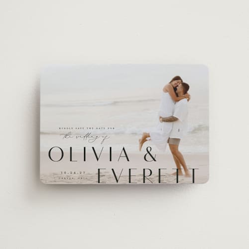 This is a onyx save the date magnets with standard by Emily Betts called modern classic names printing on magnet paper in magnet