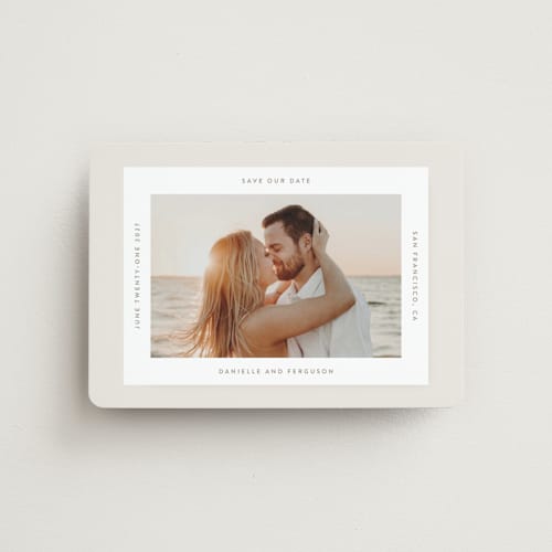 This is a ivory save the date magnets with standard by Tamara Hilje called horizonte printing on magnet paper in magnet