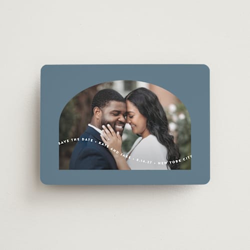 This is a dusty blue save the date magnets with standard by Leah Ragain called wavy arch printing on magnet paper in magnet