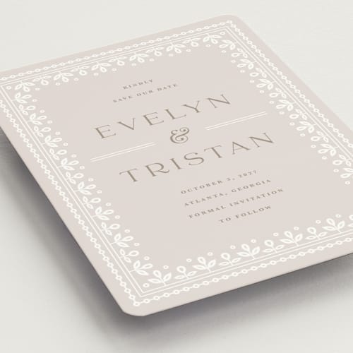 This is a cream save the date magnets with standard by Kristen Smith called lace trim printing on magnet paper in magnet
