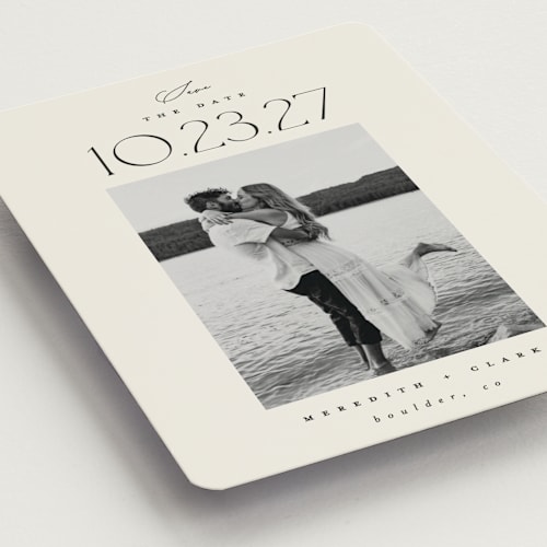 This is a ivory save the date magnets with standard by Carolyn Nicks called romancing the date printing on magnet paper in magnet