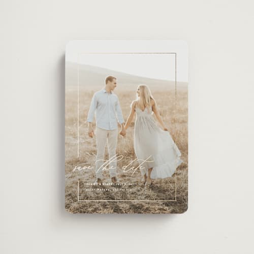 This is a linen save the date magnets with foil pressed by Kelly Schmidt called gilded frame printing on magnet paper in magnet