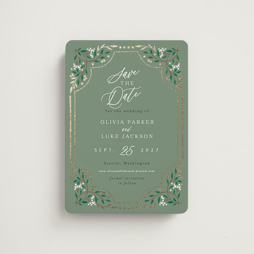 This is a evergreen save the date magnets with foil pressed by Alethea and Ruth called illuminated storybook printing on magnet paper in magnet