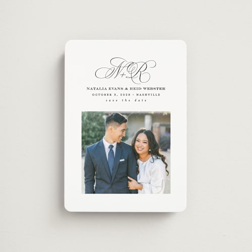 This is a newspaper save the date magnets with standard by Lea Delaveris called elegant initials printing on magnet paper in magnet