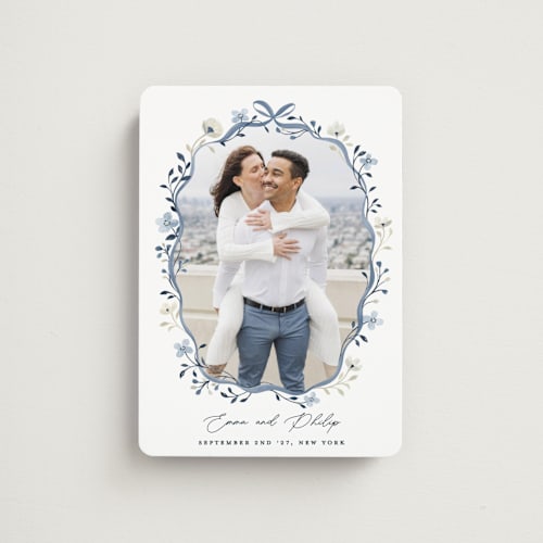 This is a french blue save the date magnets with standard by Sarah Knight called parisian ribbon printing on magnet paper in magnet
