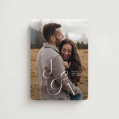 This is a ivory save the date magnets with standard by Phrosné Barwood called beautiful monogram printing on magnet paper in magnet