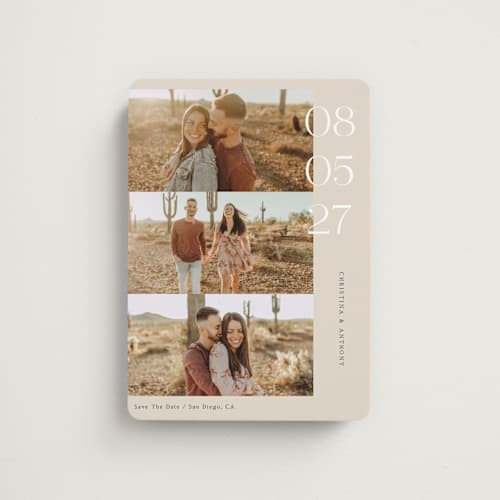 This is a sand save the date magnets with standard by Elly called cinematic love printing on magnet paper in magnet
