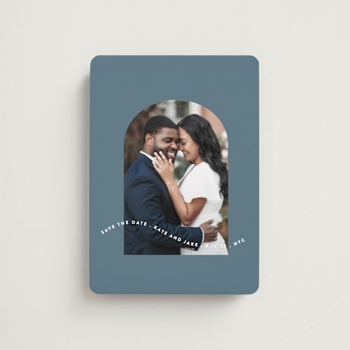 This is a dusty blue save the date magnets with standard by Leah Ragain called wavy arch printing on magnet paper in magnet