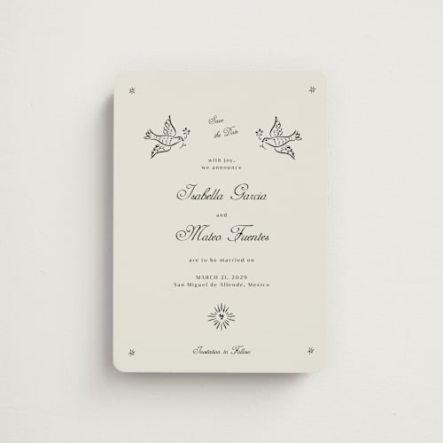 This is a ivory save the date magnets with standard by Ani Somi called milagro printing on magnet paper in magnet