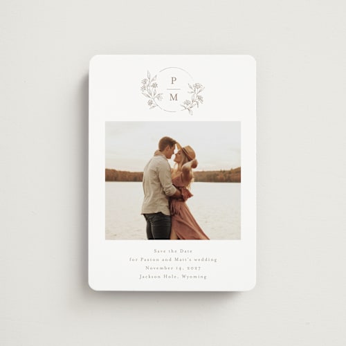 This is a taupe save the date magnets with standard by Chris Griffith called monogrammed printing on magnet paper in magnet