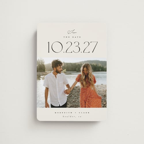 This is a ivory save the date magnets with standard by Carolyn Nicks called romancing the date printing on magnet paper in magnet