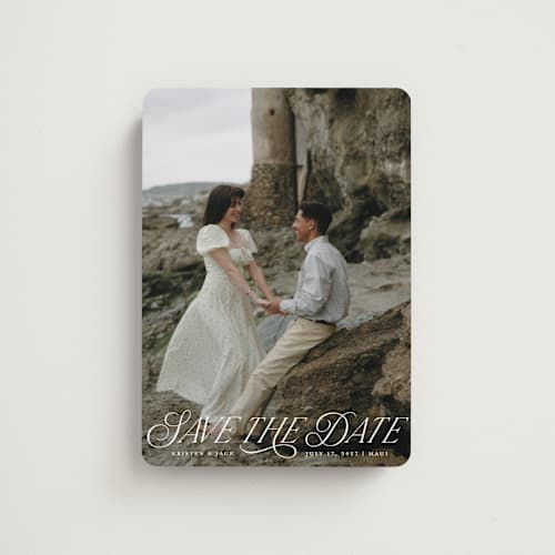 This is a porcelain save the date magnets with standard by Sarah Brown called story book printing on magnet paper in magnet