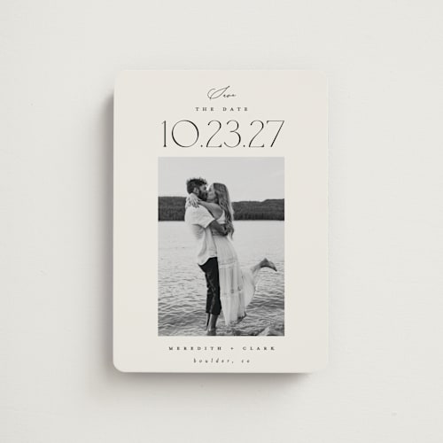 This is a ivory save the date magnets with standard by Carolyn Nicks called romancing the date printing on magnet paper in magnet