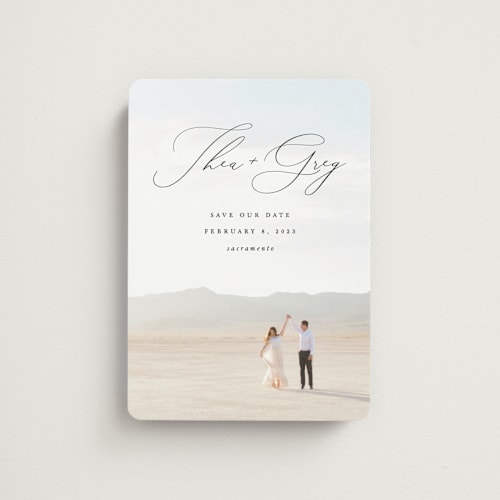 This is a graphite save the date magnets with standard by Snow and Ivy called enchantment printing on magnet paper in magnet