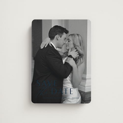 This is a navy save the date magnets with standard by Jennifer Postorino called eloquent printing on magnet paper in magnet