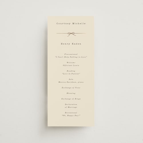 This is a ivory unique wedding programs with foil pressed by Baumbirdy called bow tie printing on signature in 4x9