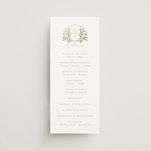 This is a ivory unique wedding programs with foil pressed by Mansi Verma called gold crest printing on signature in 4x9