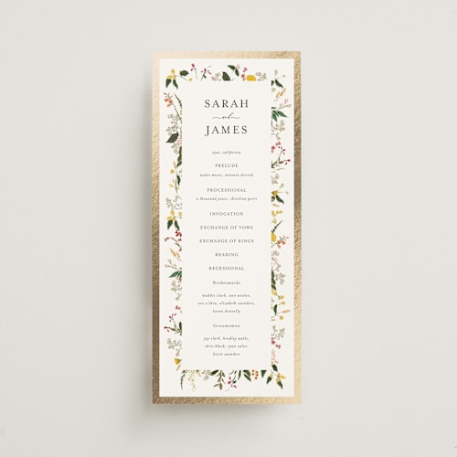 This is a burgundy unique wedding programs with foil pressed by Susan Moyal called enchanting printing on signature in 4x9