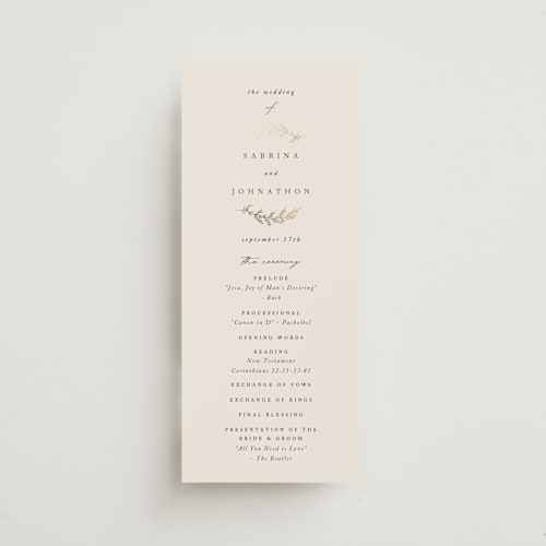 This is a ivory unique wedding programs with foil pressed by Carolyn Nicks called to hold printing on signature in standard