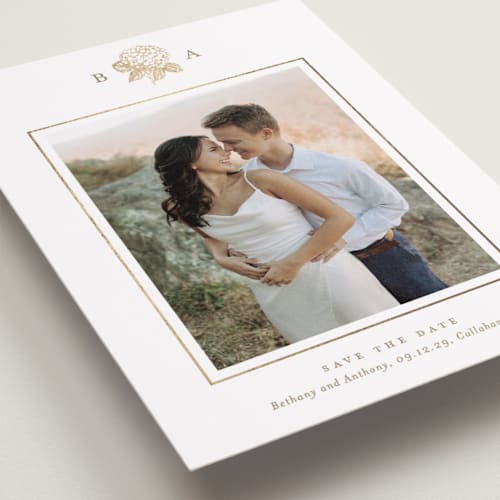 This is a cotton foil stamped save the date cards with foil pressed by Stacey Meacham called hydrangea bloom printing on recycled smooth signature in standard