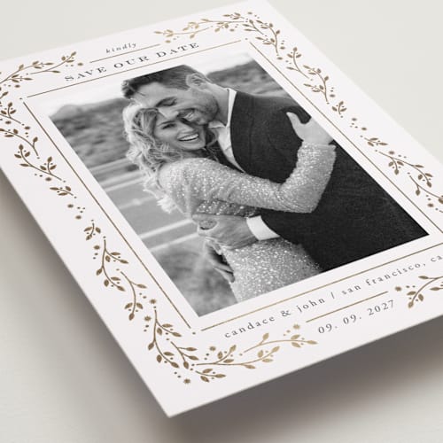 This is a snow foil stamped save the date cards with foil pressed by Ana de Sousa called fairytale printing on recycled smooth signature in standard