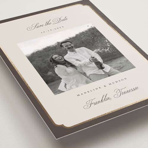 This is a cognac foil stamped save the date cards with foil pressed by Emily Betts called arch frame printing on recycled smooth signature in standard