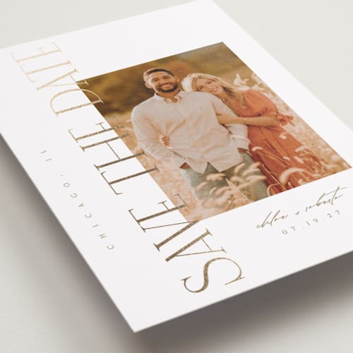 This is a golden foil stamped save the date cards with foil pressed by Kelly Schmidt called sideways printing on recycled smooth signature in standard