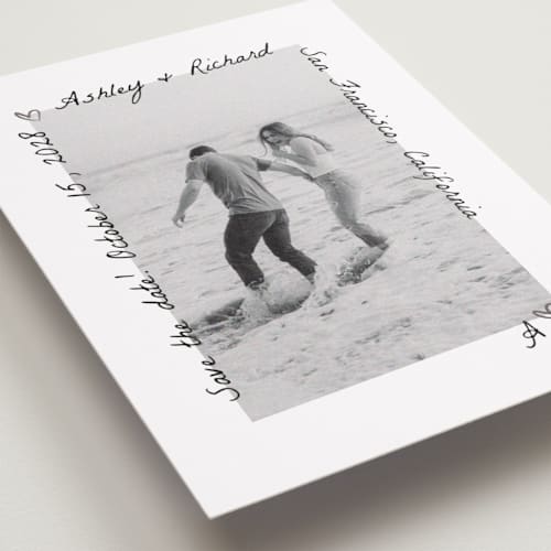 This is a graphite foil stamped save the date cards with foil pressed by Claudia Orengo called showered printing on recycled smooth signature in standard