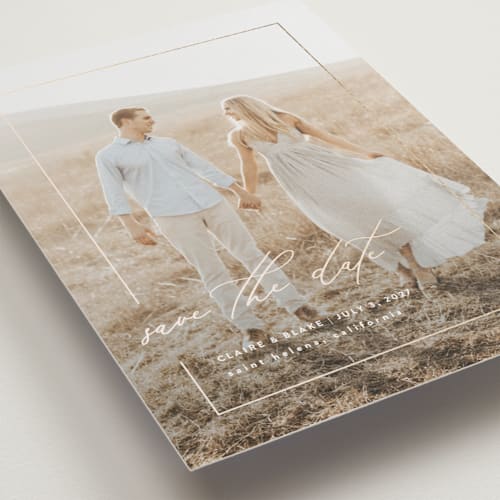 This is a linen foil stamped save the date cards with foil pressed by Kelly Schmidt called gilded frame printing on recycled smooth signature in standard