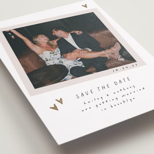 This is a ink foil stamped save the date cards with foil pressed by Ashley Iwafuchi called scribbled hearts printing on recycled smooth signature in standard