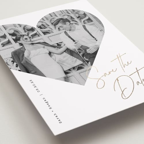 This is a snow foil stamped save the date cards with foil pressed by Sarah Curry called hearted printing on recycled smooth signature in standard
