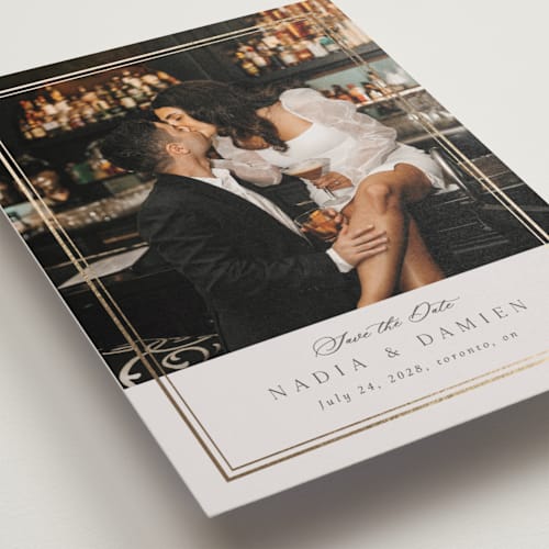 This is a linen foil stamped save the date cards with foil pressed by Nicole Walsh called shimmer printing on recycled smooth signature in standard