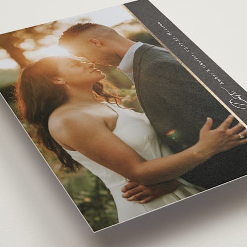 This is a charcoal foil stamped save the date cards with foil pressed by Jessica Williams called sideline printing on recycled smooth signature in standard