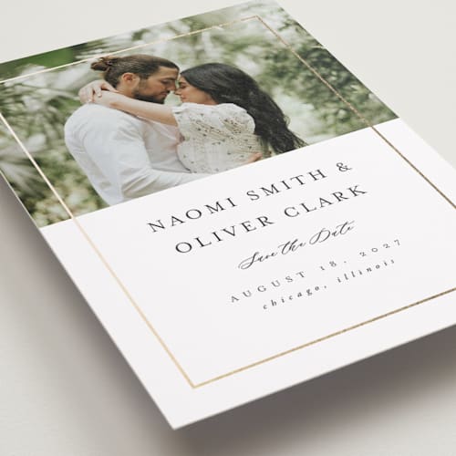 This is a pearl foil stamped save the date cards with foil pressed by Nicole Walsh called gilded frame printing on recycled smooth signature in standard