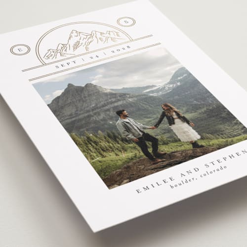 This is a chiffon foil stamped save the date cards with foil pressed by Heather Schertzer called mountaintop crest printing on recycled smooth signature in standard