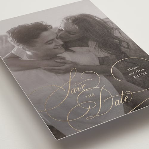 This is a cream foil stamped save the date cards with foil pressed by Hooray Creative called elegantly scripted printing on recycled smooth signature in standard
