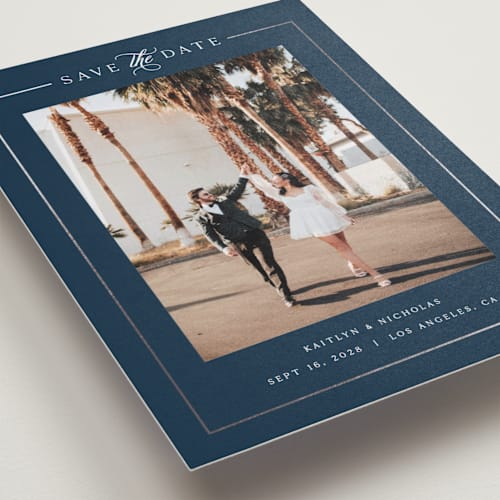 This is a navy foil stamped save the date cards with foil pressed by Melanie Kosuge called mulholland printing on recycled smooth signature in standard